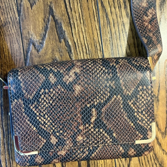 Black and brown animal print small sized crossbody purse. - Picture 3 of 11